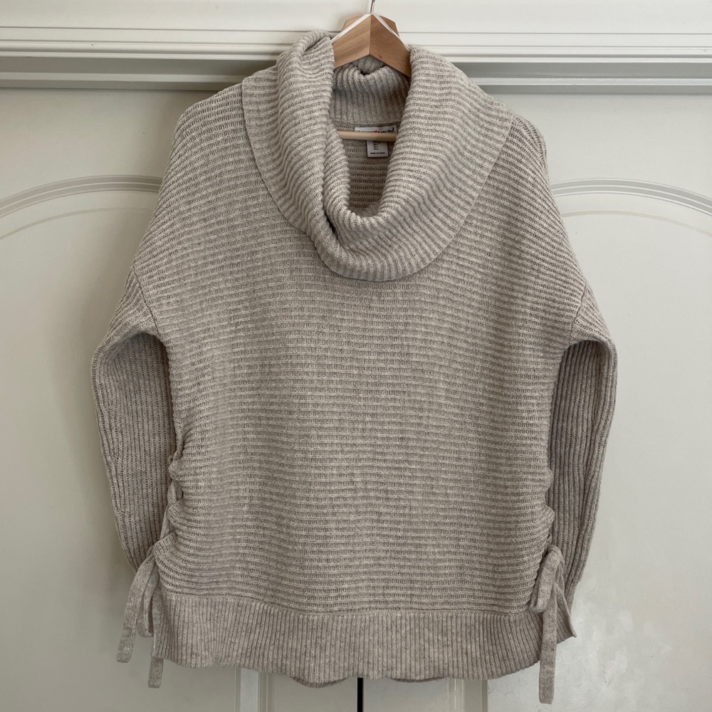 Wearing Your Heart on Your Sleeve turtle neck sweater with tie sides.